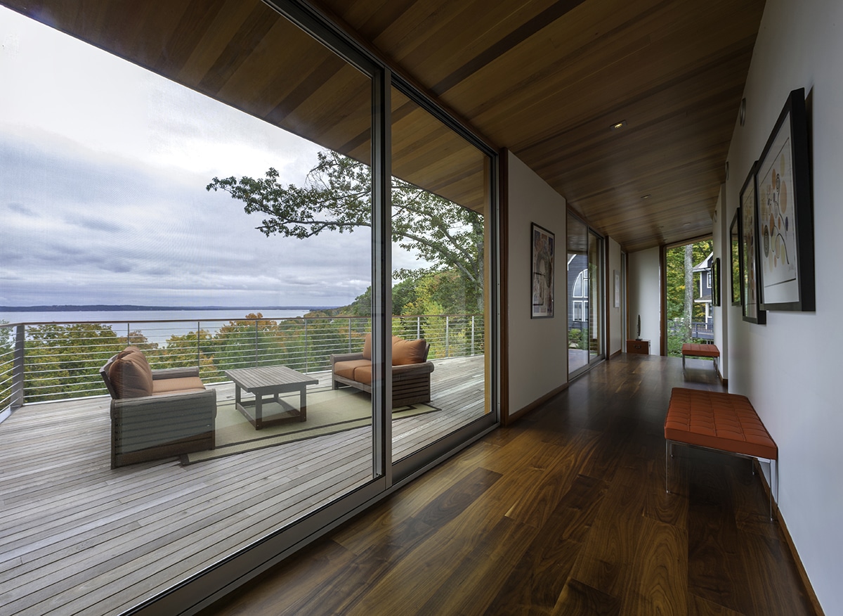 Two Western Window Systems multi-slide doors make it easier to gaze upon a beautiful lake.