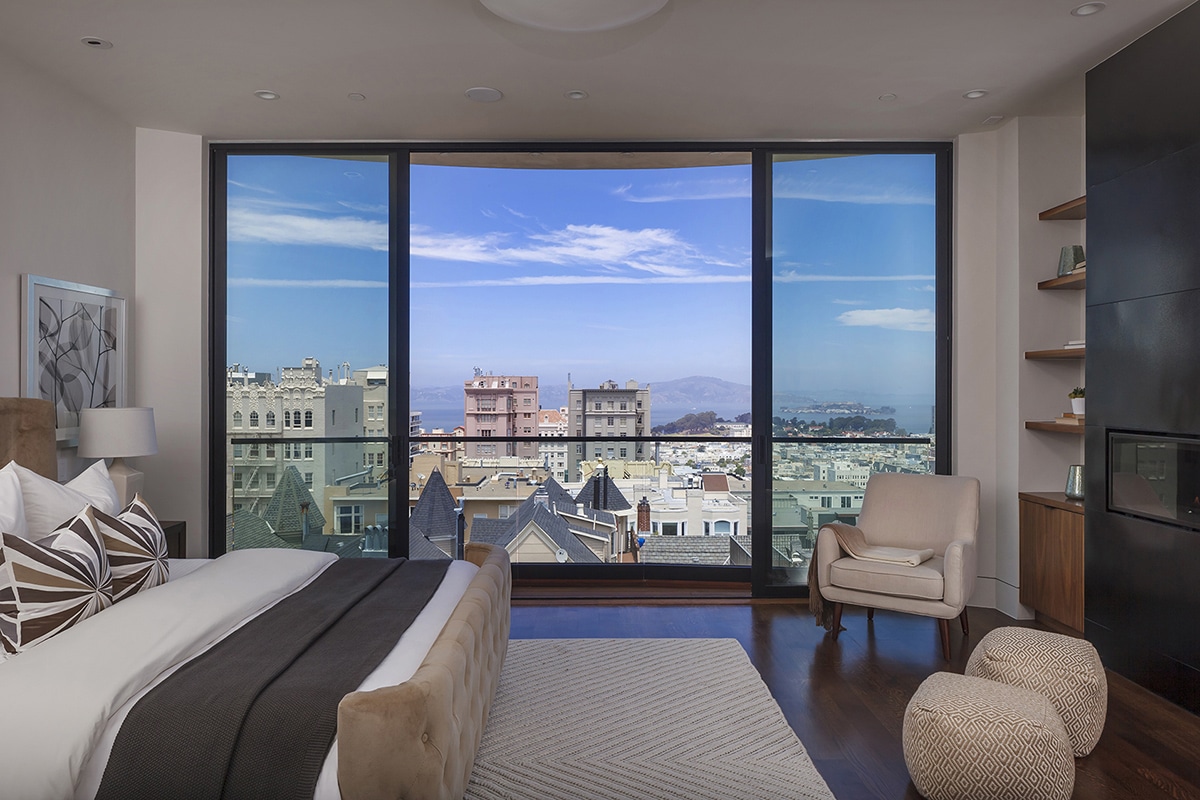 A contemporary-looking parting sliding door in the third-floor master suite provides views of Alcatraz and the San Francisco Bay.