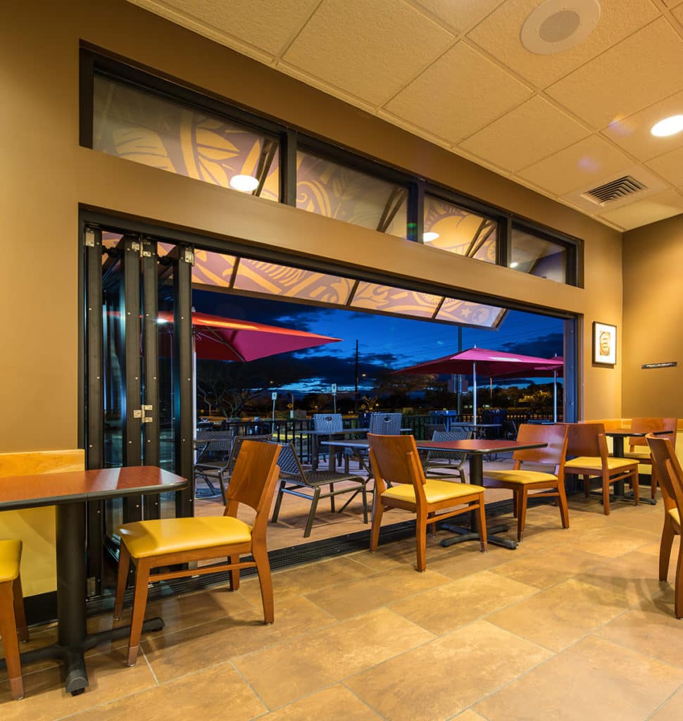 This giant stacking bi-fold door connects the inside of the restaurant to a dining patio outdoors.