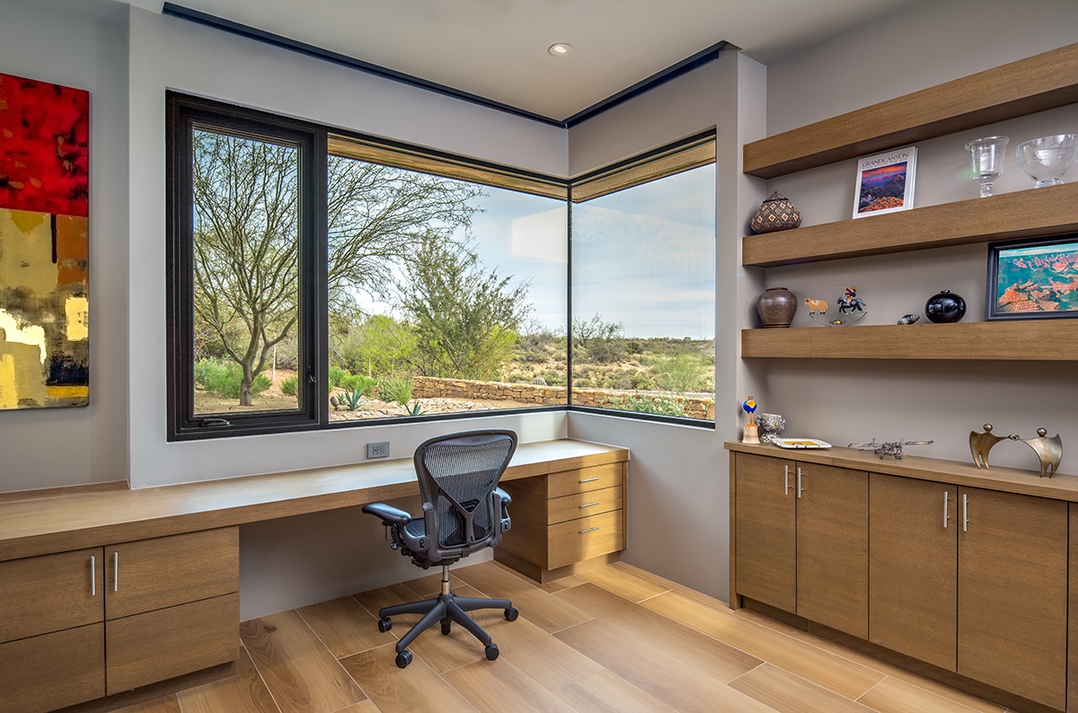 A Series 670 Casement Window in the home office swings open to let in fresh air.