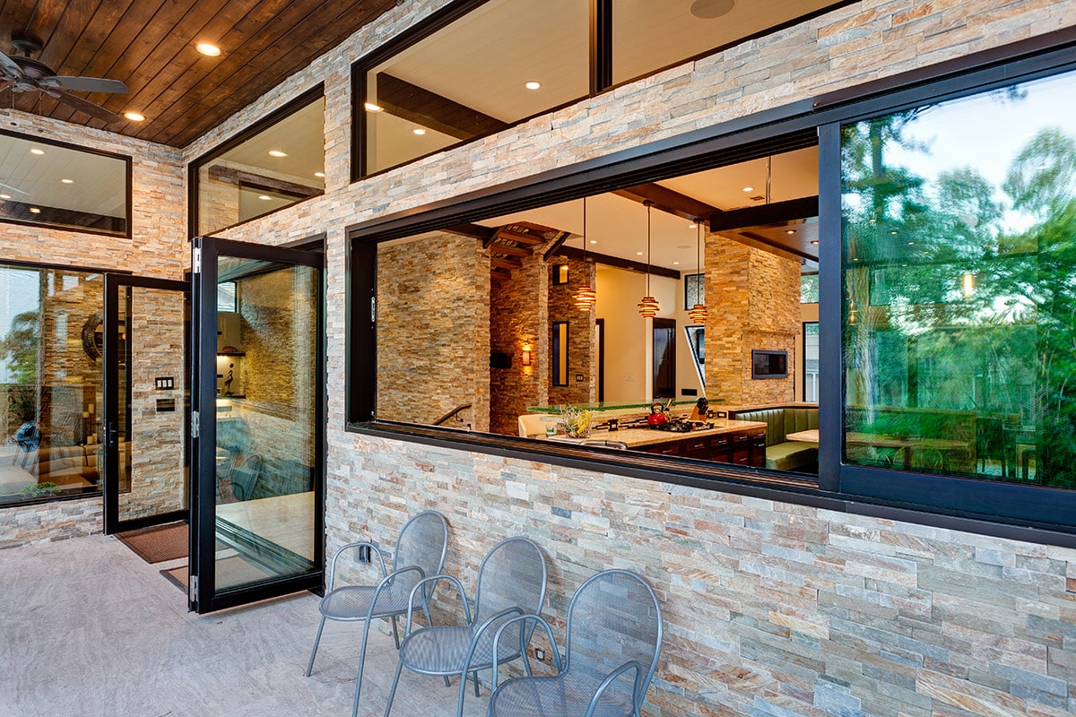 When opened, the multi-slide window in the kitchen allows fresh Texas breezes to course through the home.