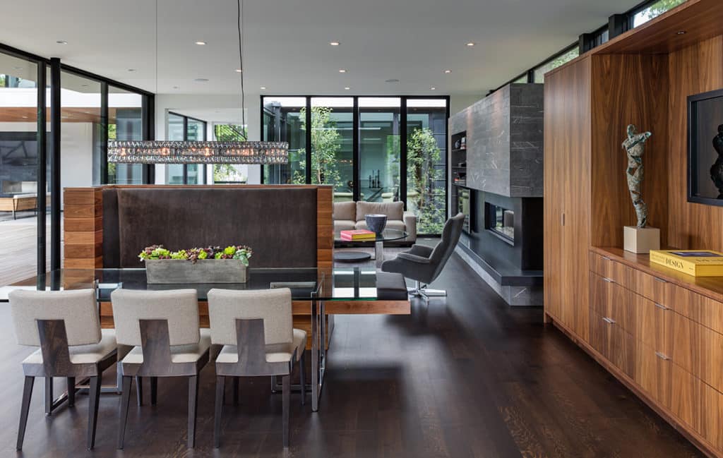 Sliding glass doors and fixed windows bring natural light into the living room and dining room.