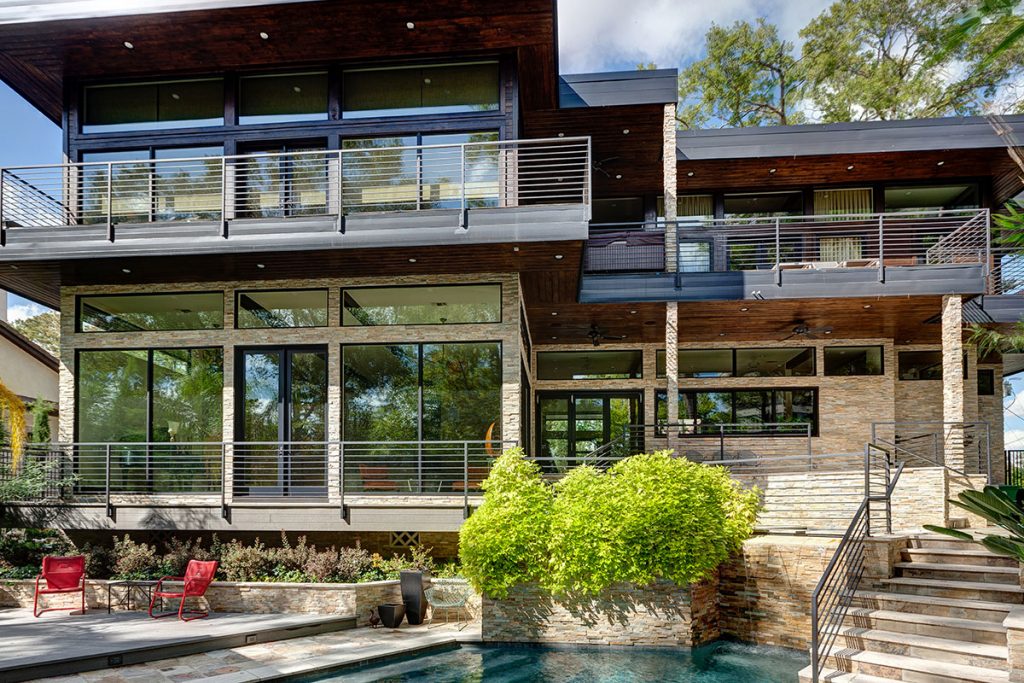 A view of the Frank Lloyd Wright-inspired design that is highlighted by vast expanses of glass on both house levels.
