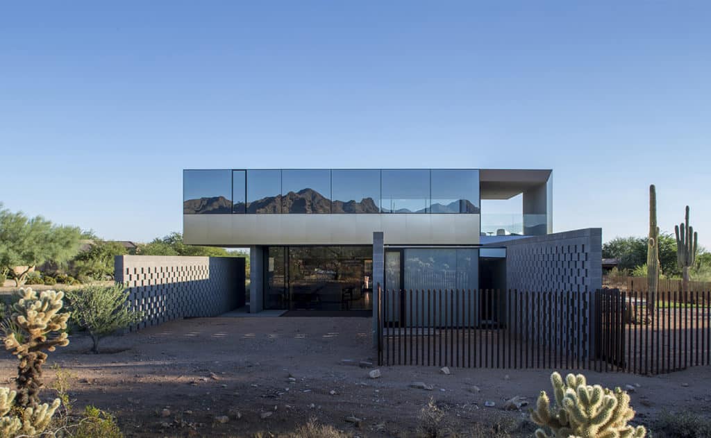 The upstairs expanse of glass creates a beautiful reflection of the McDowell Mountains near Scottsdale.