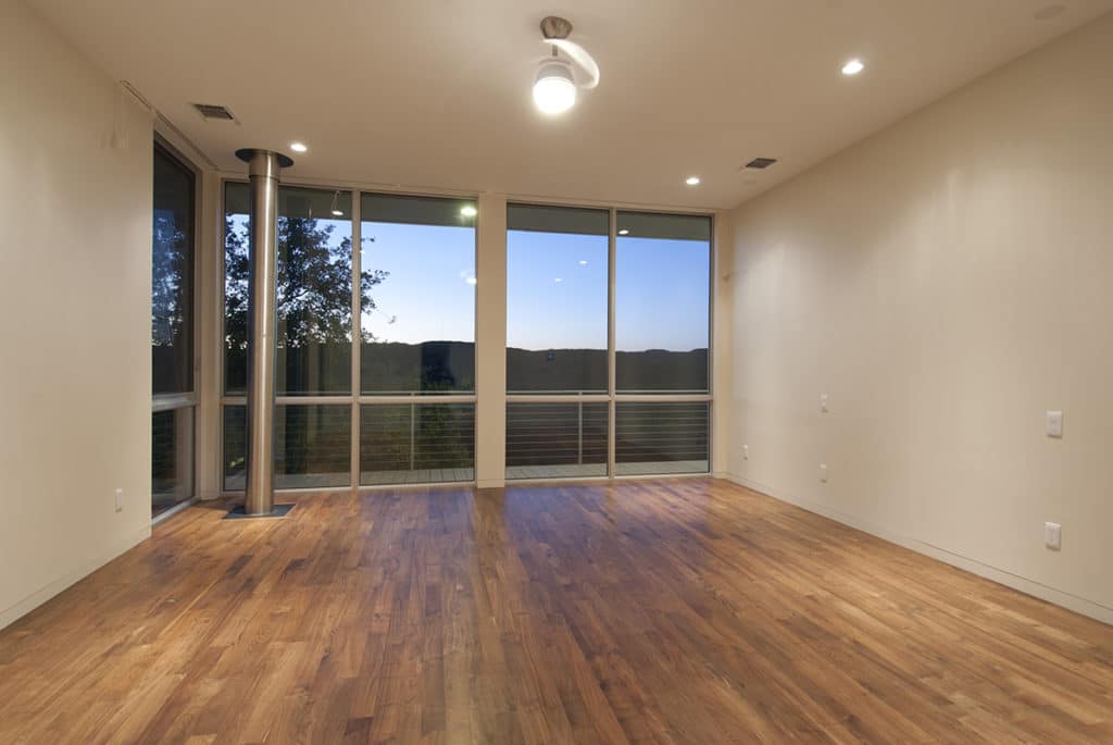 A second-floor window wall lets in tons of natural Texas light.