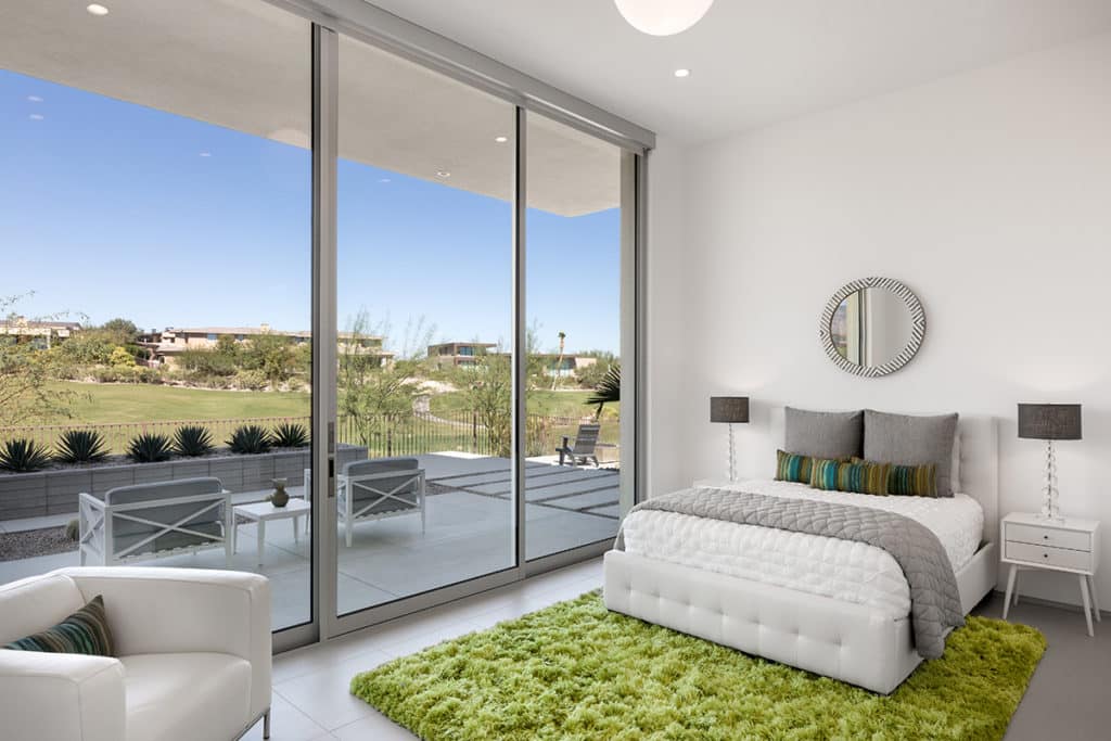 Each of the bedrooms features a wall-length Series 600 Multi-Slide Door.