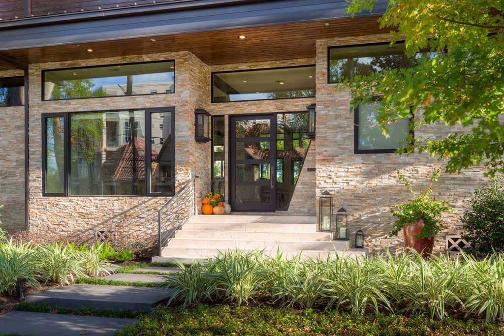 A combination of fixed and operable windows in the front of the home provides both form and function.