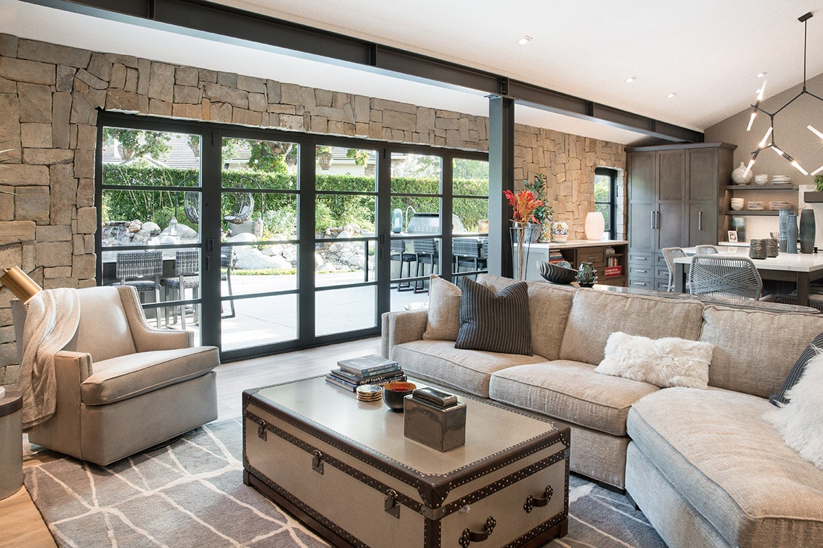 The sleek look of the multi-paned door provides an enticing view of the backyard from the living room.