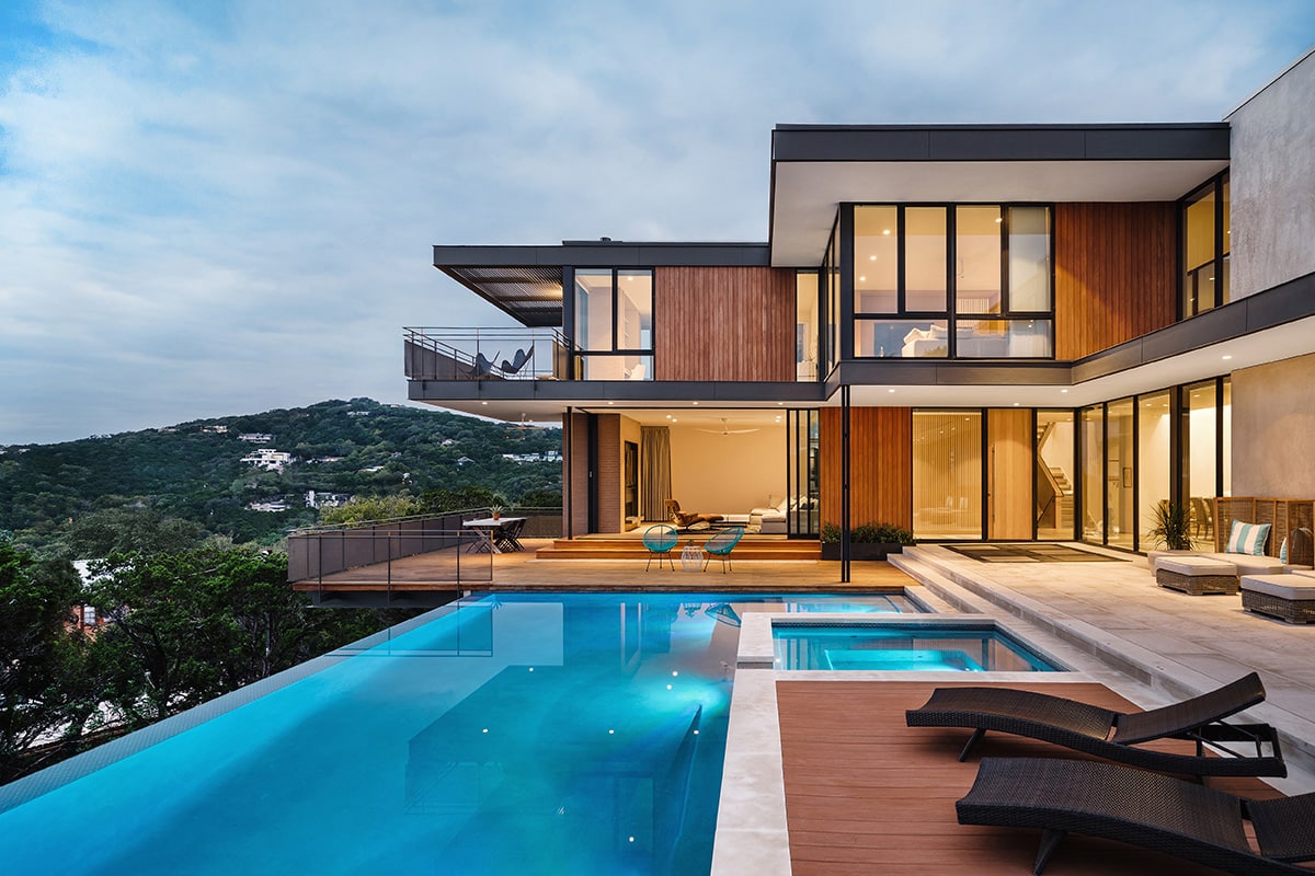 Large expanses of glass on both stories of this home opens to the terraces and views beyond.