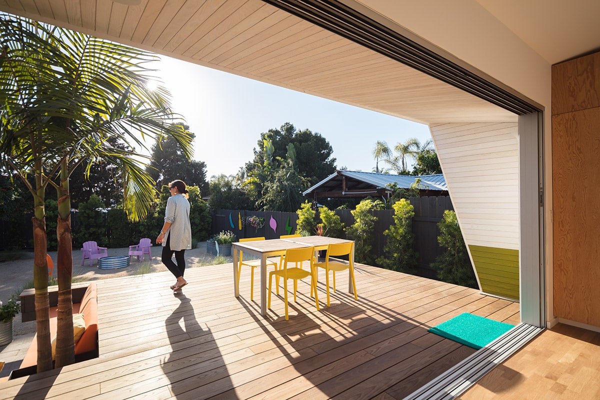 A large multi-slide door eliminates the home’s barrier to the backyard patio