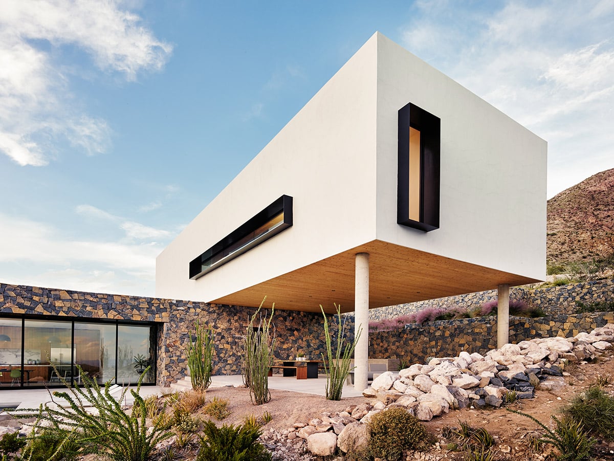 The white stucco volume stands out amid the rocky terrain of the Franklin Mountains near El Paso.