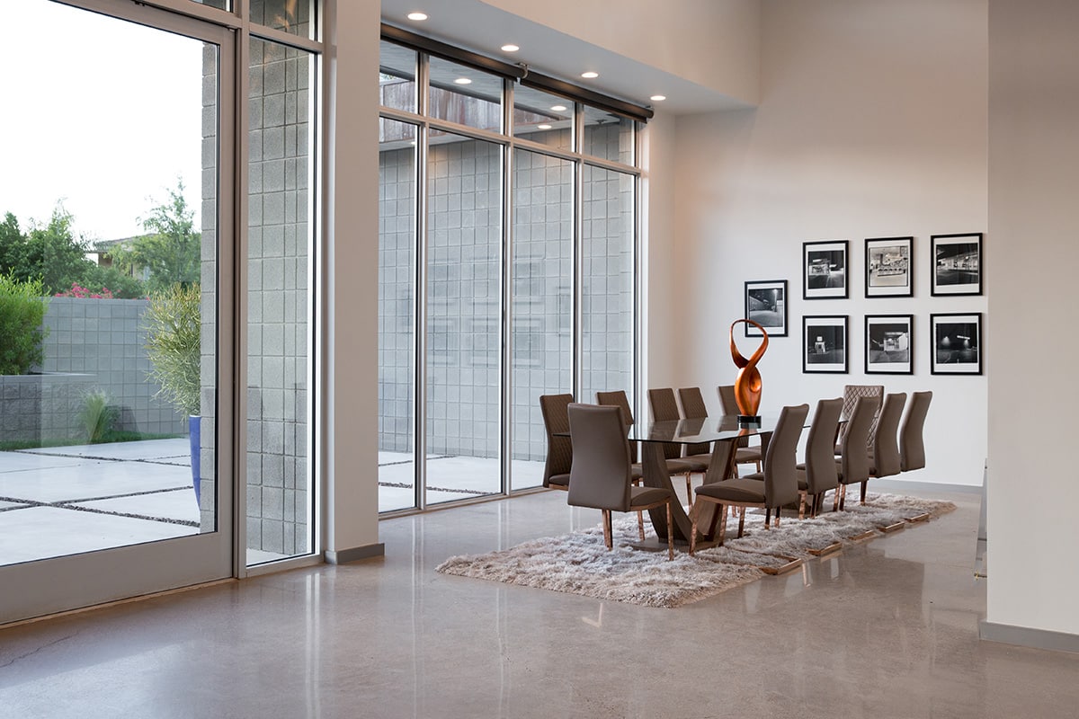A giant window wall lets in loads of natural light in the dining room while maintaining peak energy efficiency.