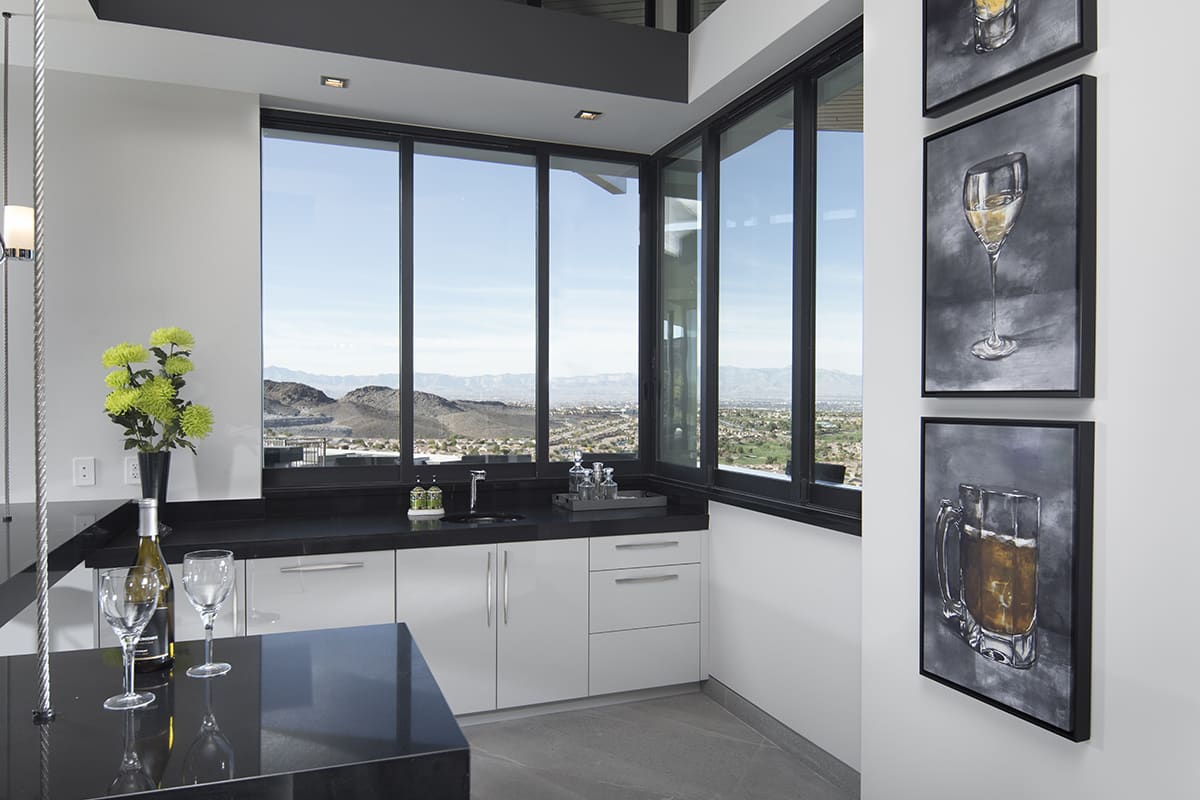 A 90-degree window helps give this bar area a clean, contemporary look with views the scenery below.