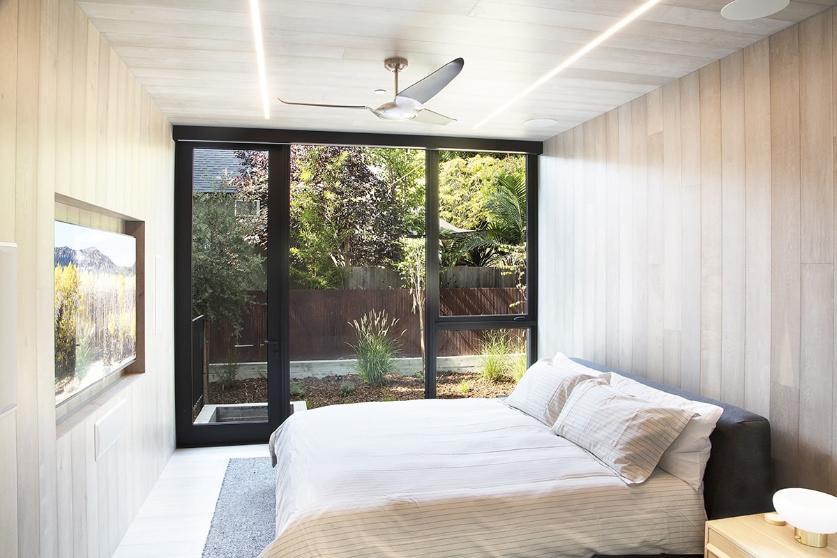 A hinged door and hinged windows let tons of natural light into the bedrooms.