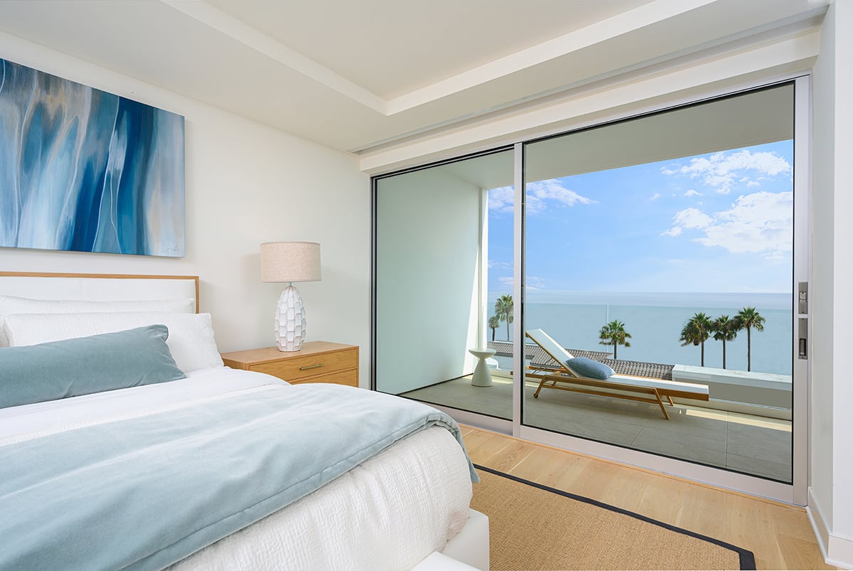 Floor-to-ceiling sliding glass doors in the three-bedroom units open to unparalleled ocean views.