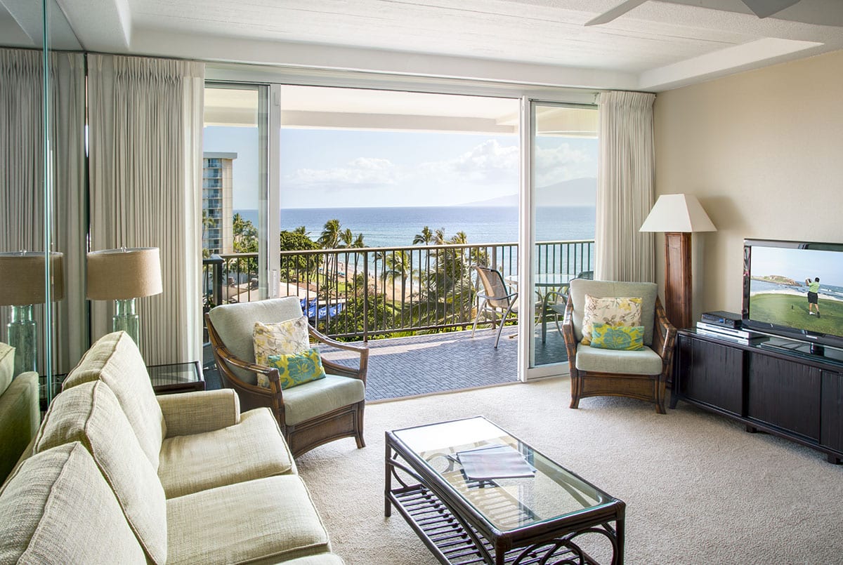Natural light and fresh Hawaiian air flood the rooms when the sliders are open, providing views of the beach.