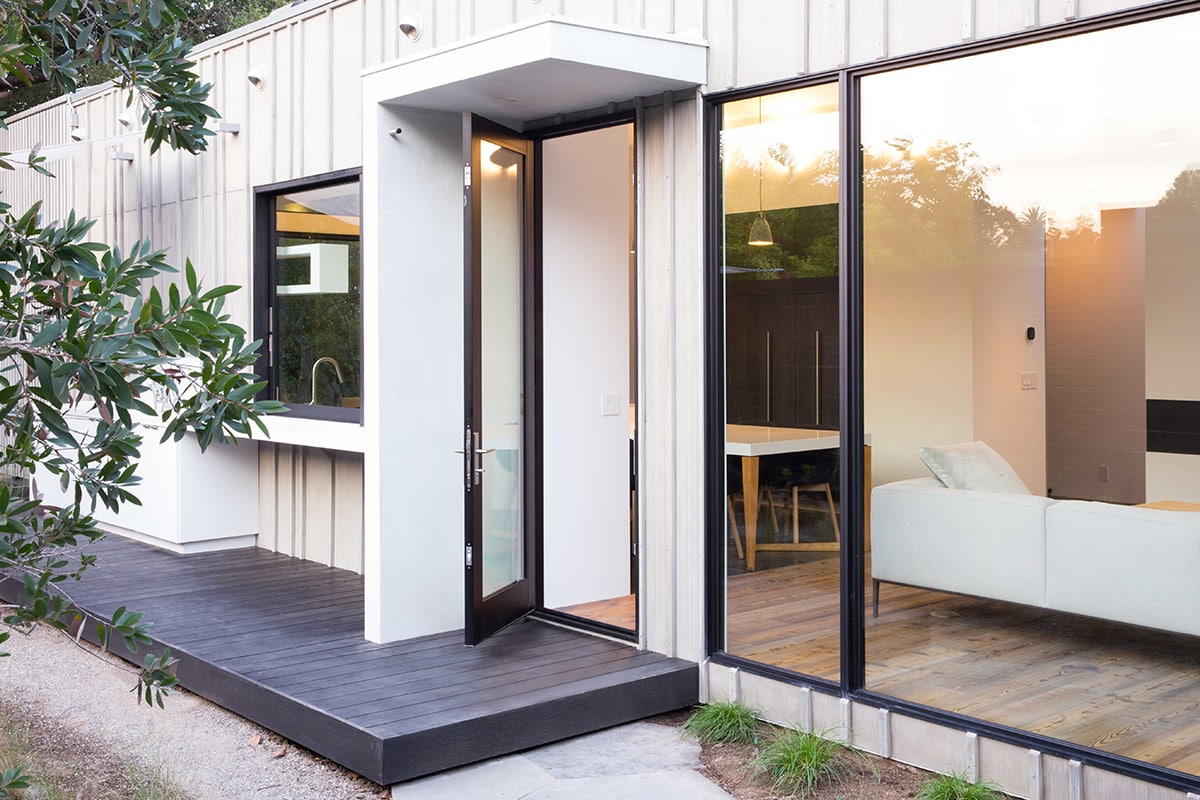 A hinged door allows further access to the backyard from the kitchen and living room.