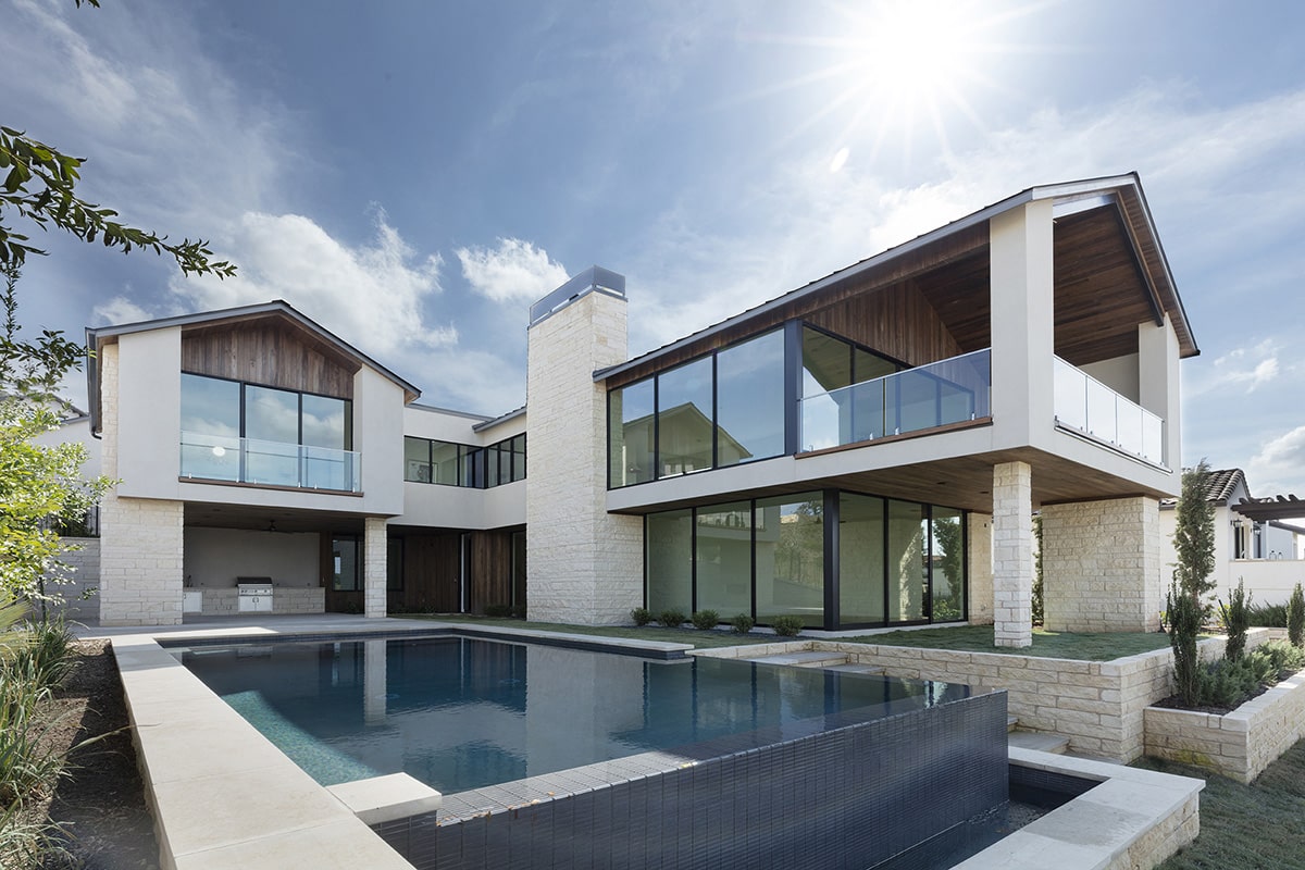 The 4,479 square-foot house features wall-to-wall, floor-to-ceiling glass which overlooks the backyard and pool.