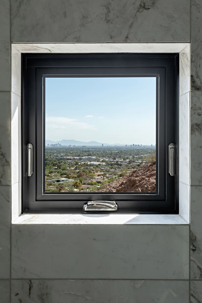 A small window provides a view of Camelback Mountain.