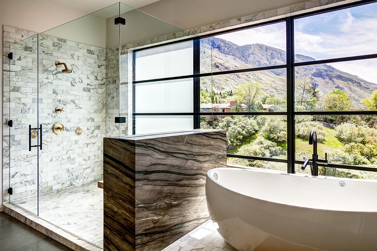 Landscape views can be seen from the bathtub and shower through a large, divided lights window.