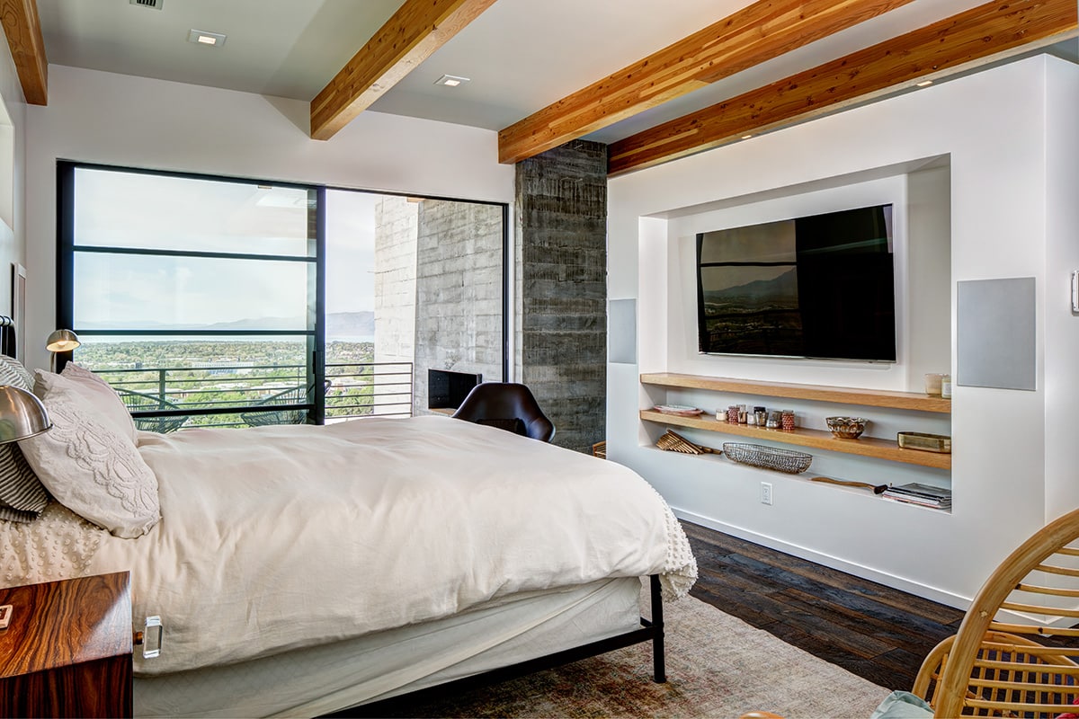 Huge expanses of glass let in copious amounts of Utah sunshine in this bedroom.