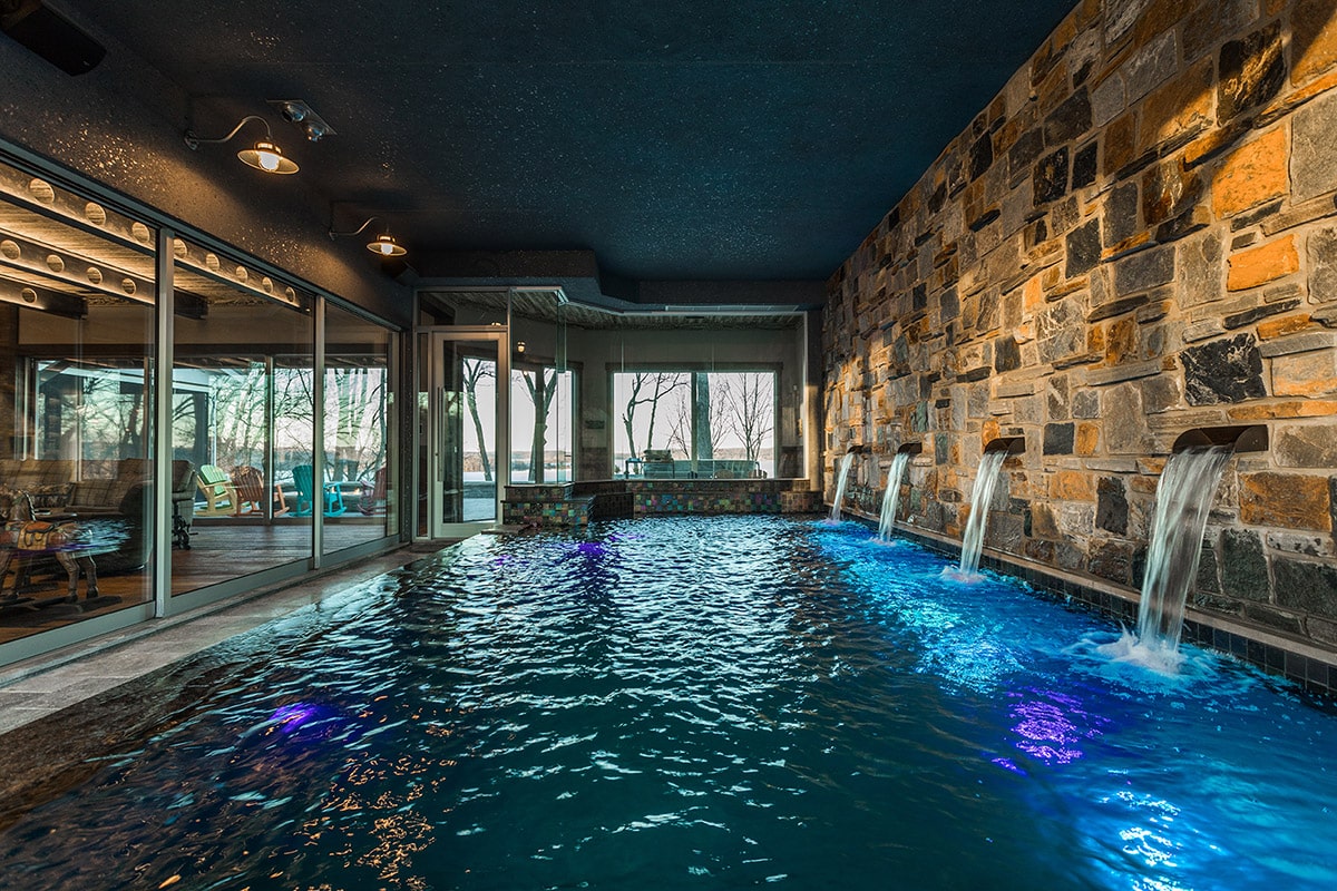 The indoor swimming pool is separated from the main living space from a huge multi-slide door.