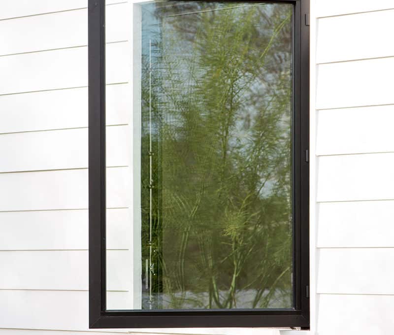 A view of the clean aesthetic of Western Window Systems’ hinged window that is open on display.