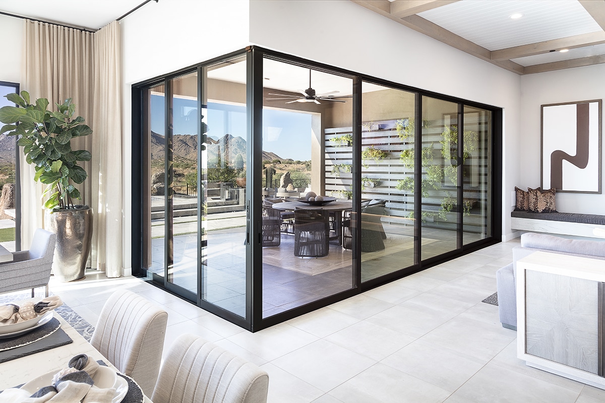 A closed 90-degree multi-slide door that leads to an outdoor dining area.