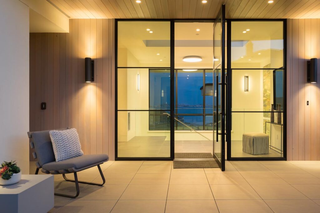 Glass walls and pivot entry door.