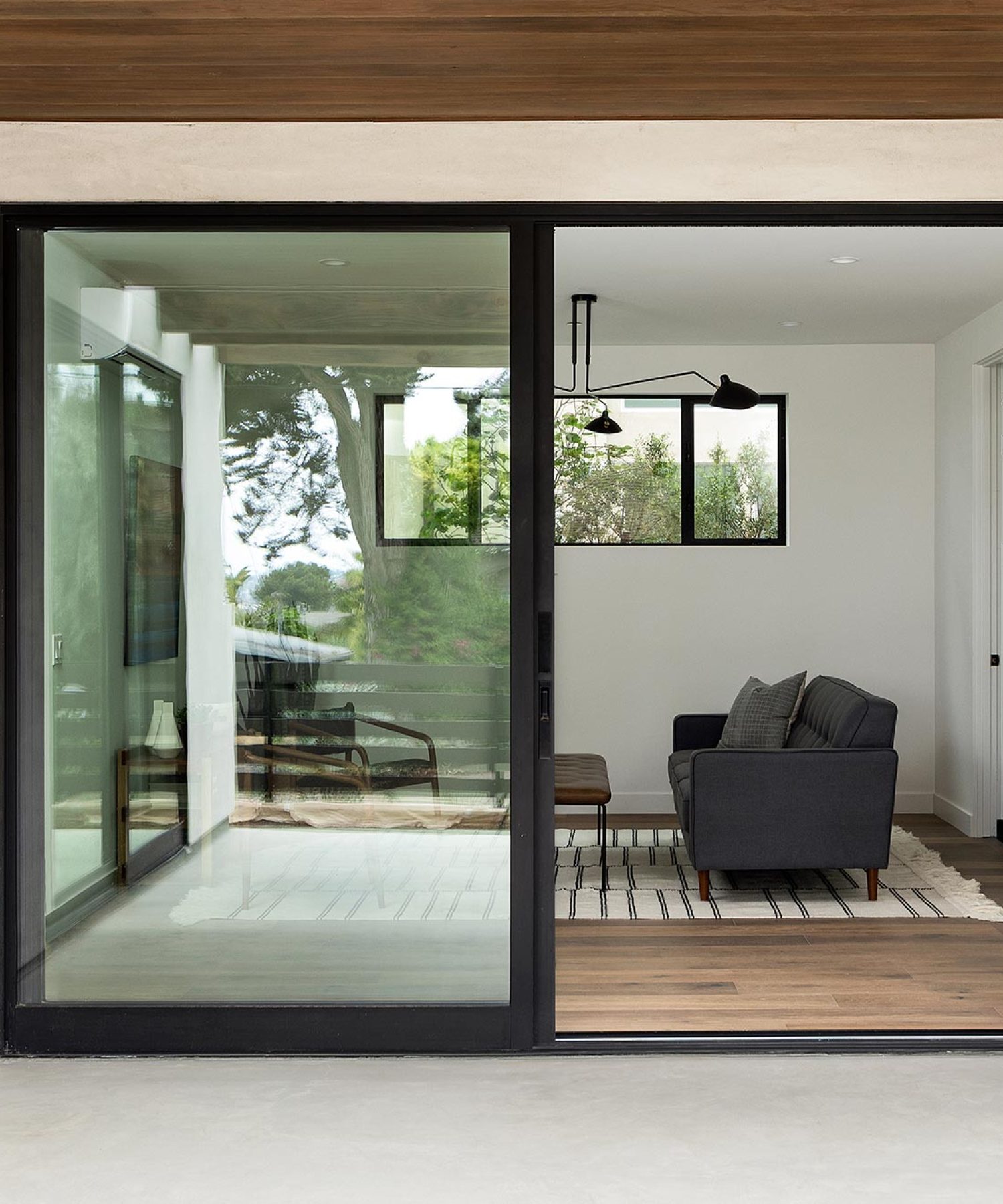 A large sliding glass door leads into the living room.
