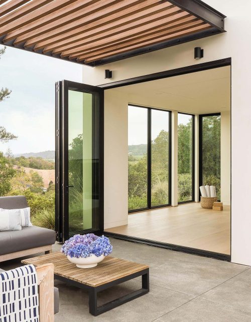 When fully open, this bi-fold door connects the patio with the pool house’s interior.