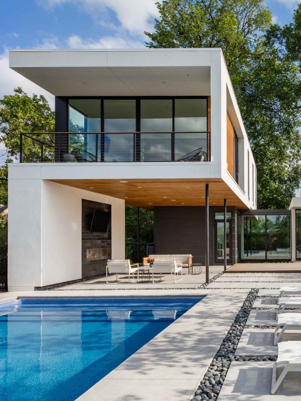 The second floor of this home has floor-to-ceiling multi-slide doors that connect to the balcony.